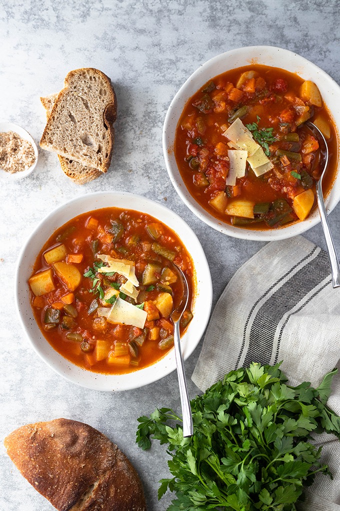 two bowls of minestrone soup 