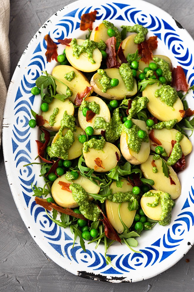pesto potato salad on blue and white enamel plate