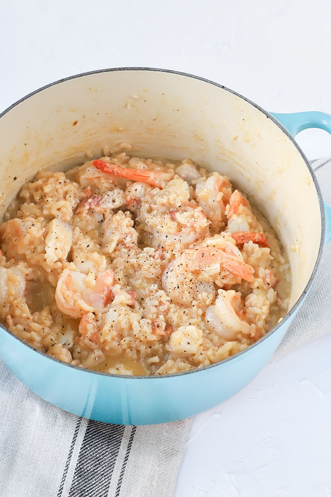 finished prawn risotto in blue dutch oven
